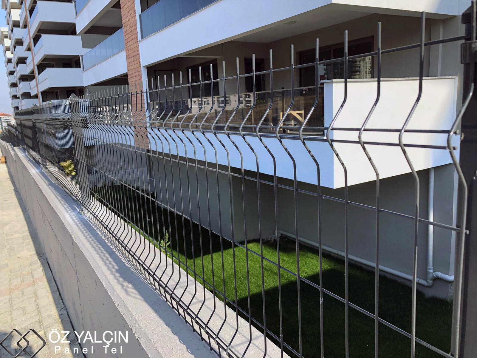 Galvanised bent welded mesh fence installed around a residential building